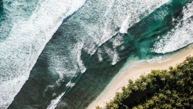 Photo of A Mentawai Local with a World-Class wave in his Backyard