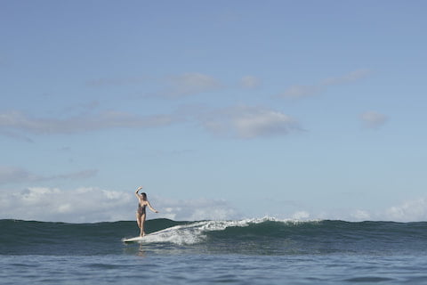 Beautiful Woman Longboarding at Nusa Tenggara Barat Retreat
