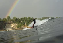Longboarding coach glassy surf rainbow